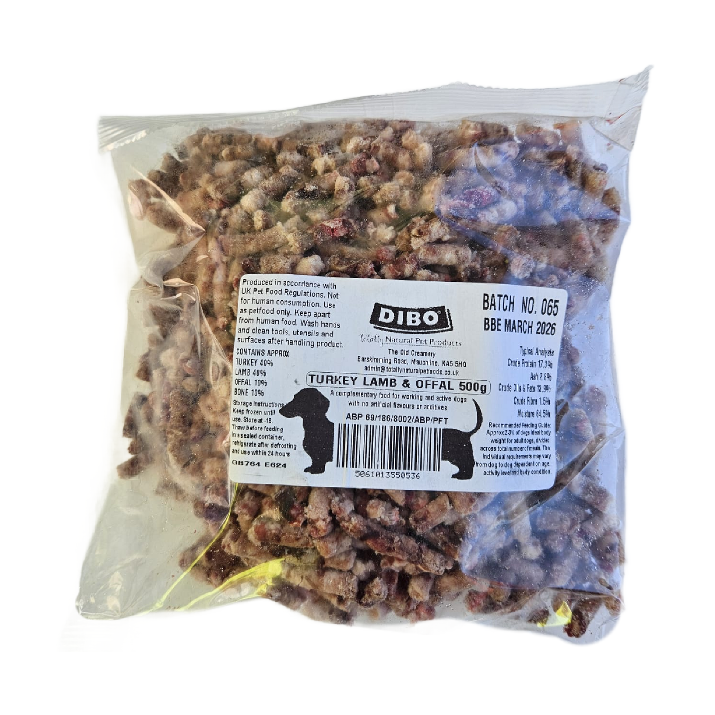 Packaged raw dog food product made of turkey, lamb, and offal in a clear plastic bag with a label showing the brand and product details.