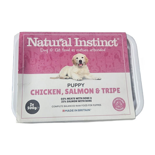Package of Natural Instinct puppy food with a pink label featuring a dog.