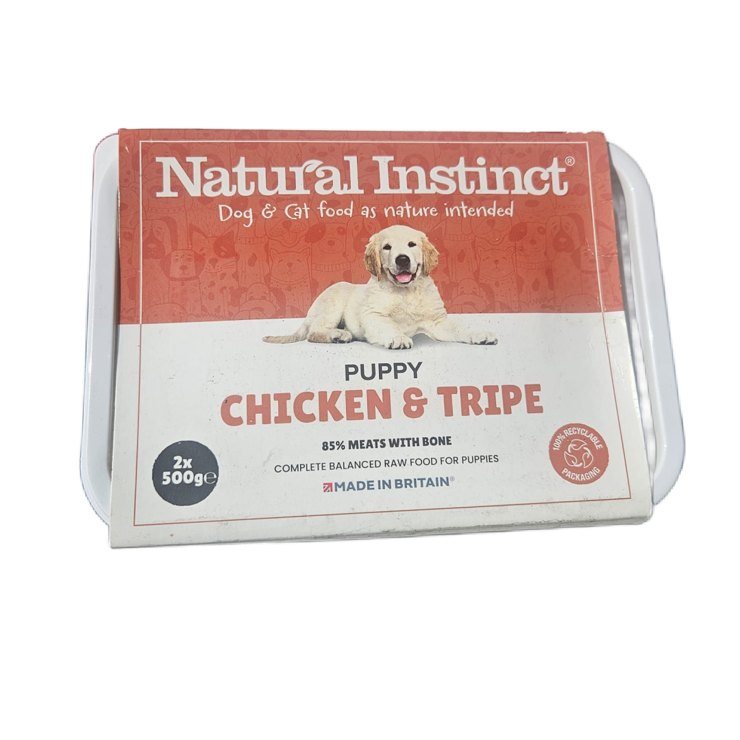 Package of Natural Instinct Puppy Chicken & Tripe dog food on a white background