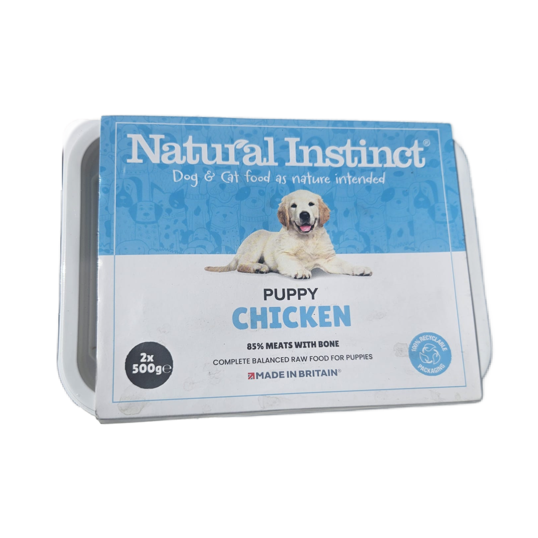 Package of Natural Instinct Puppy Chicken dog food on a white background