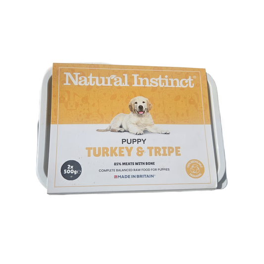 Dog food package with 'Natural Instinct' branding on a white background